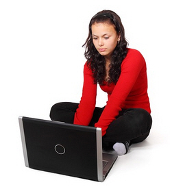 woman sitting on the floor with a laptop computer