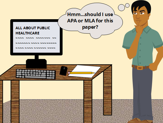 A man standing next to a computer wondering if he should use APA or MLA in his paper.