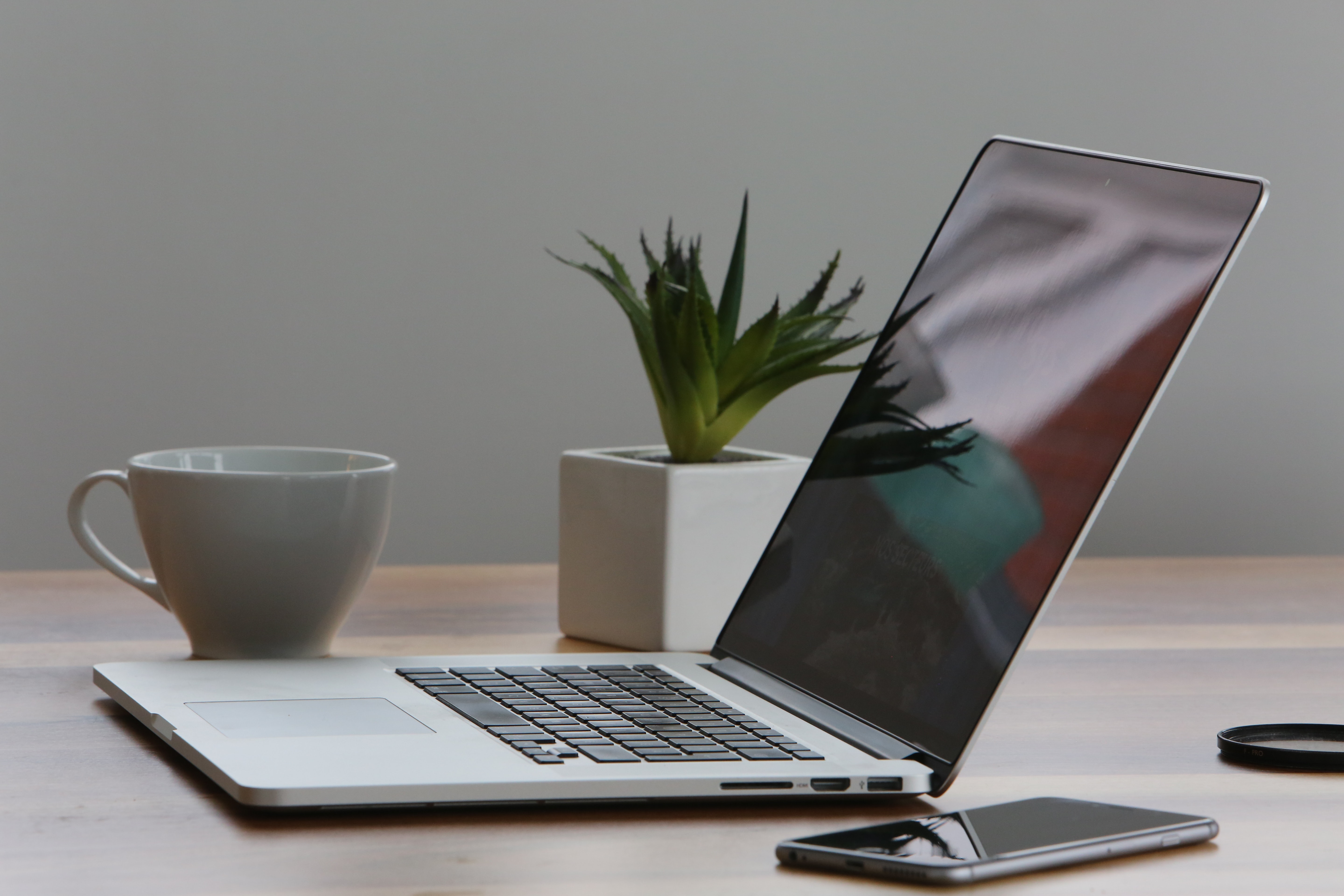 A computer open on a desk use for online writing and presentations.