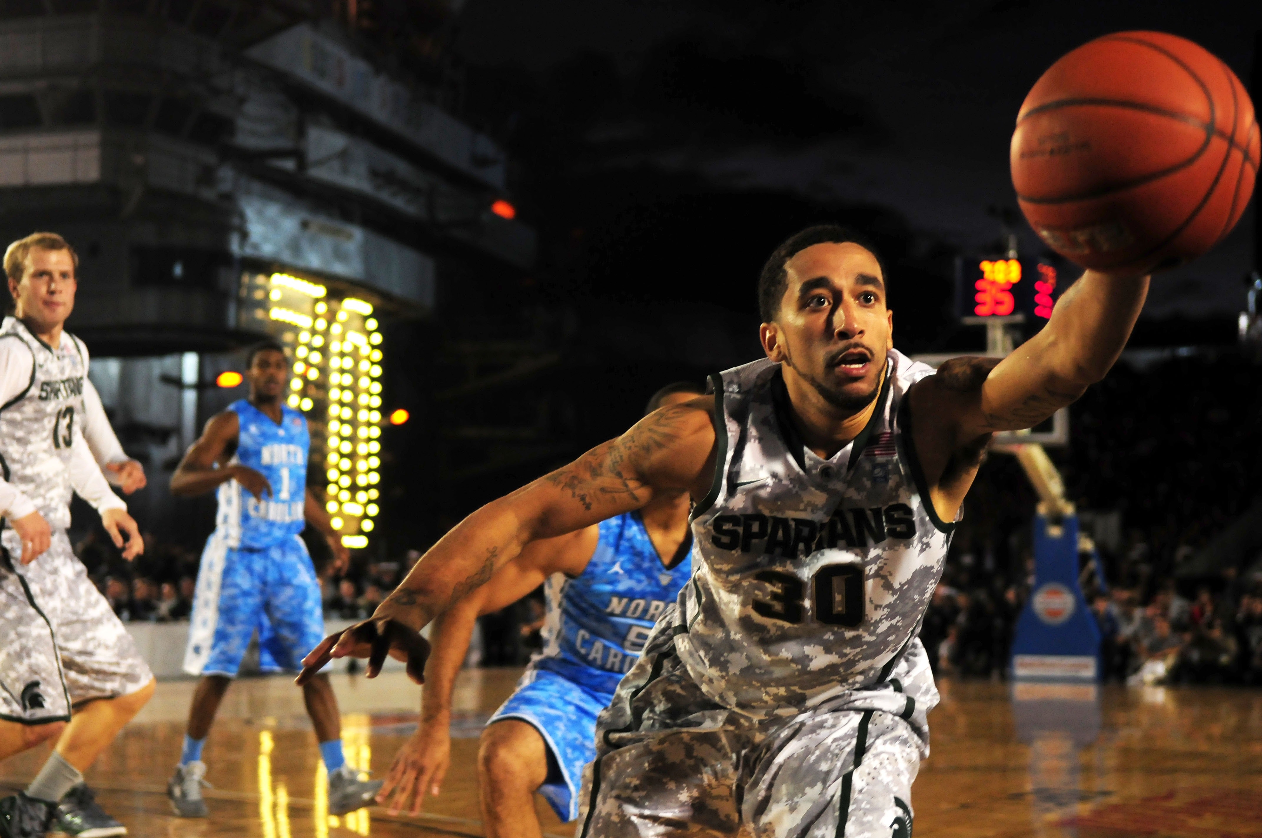 basketball player reaching for the basketball