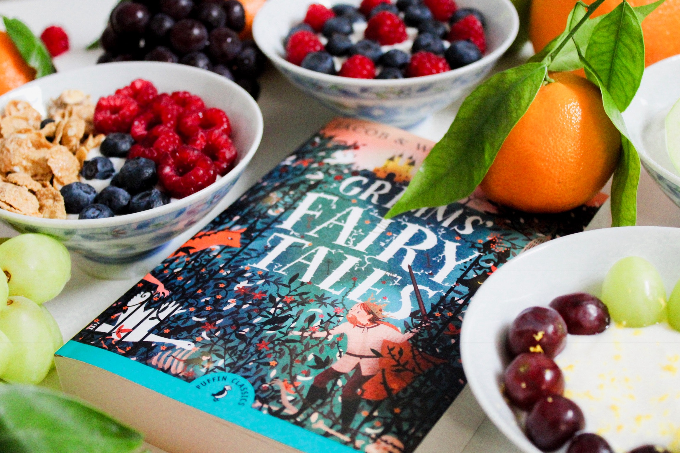 Grimm' Fairy Tales surrounded by fruit