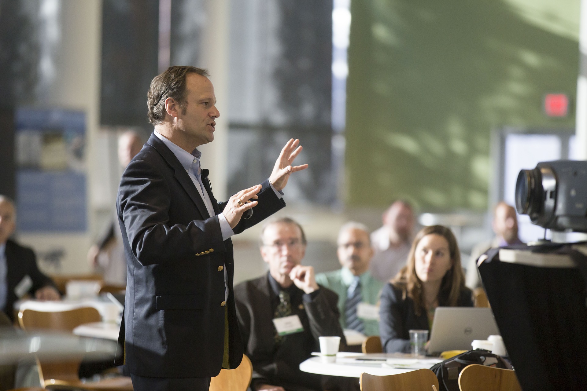 A man speaking at a conference