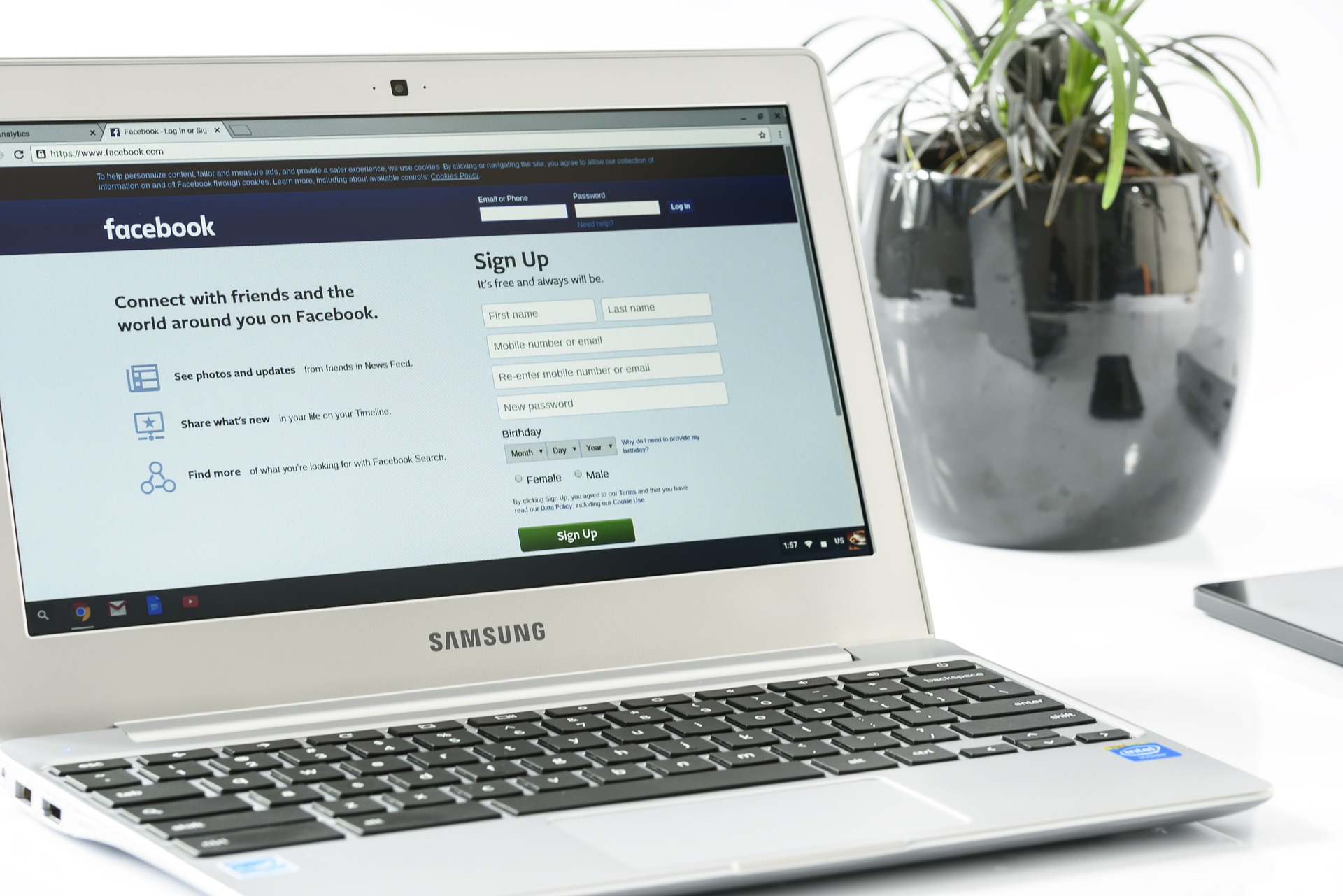 A laptop showing the Facebook login
