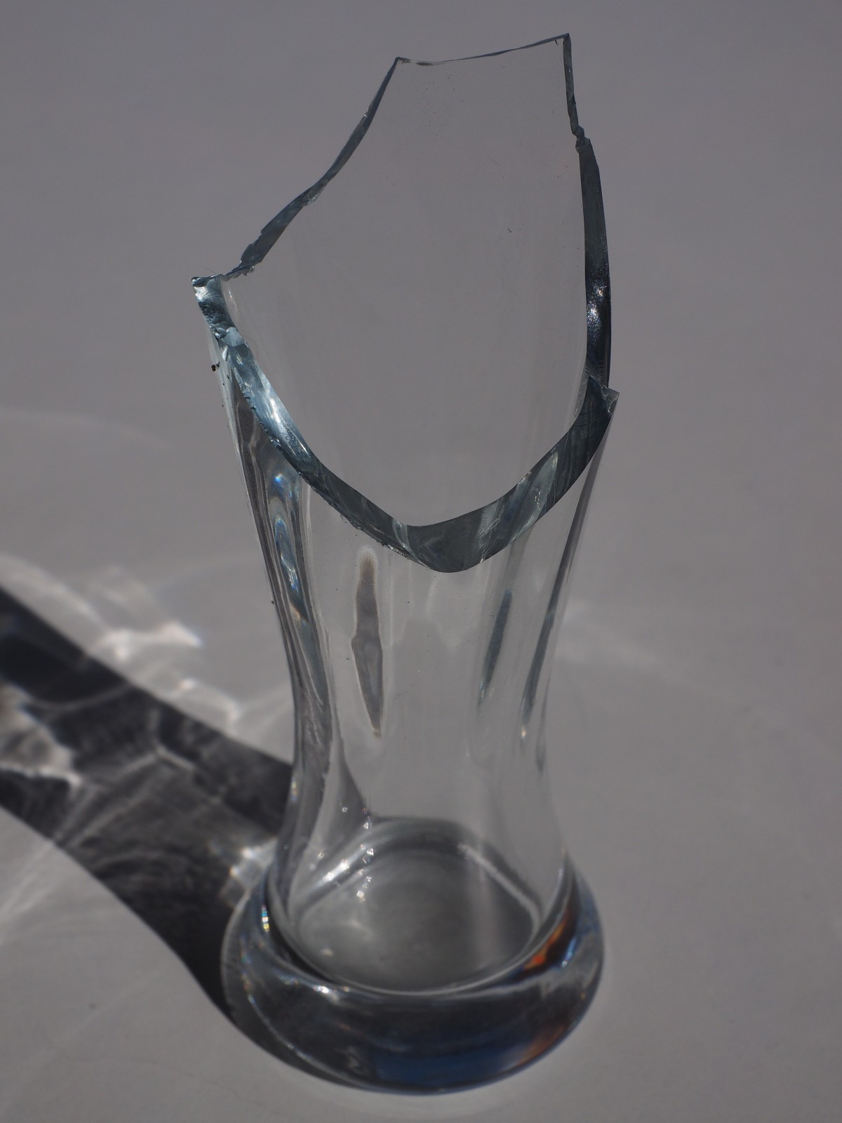 A broken clear vase