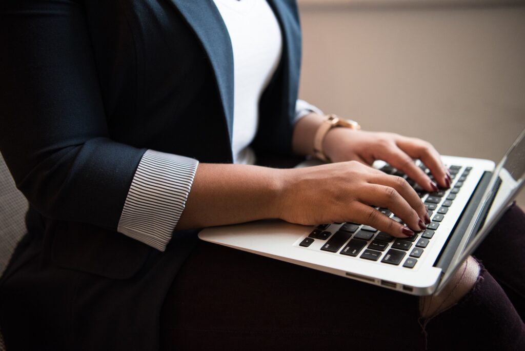 Woman typing on a laptop