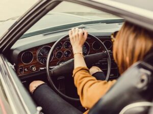 A woman driving a car.