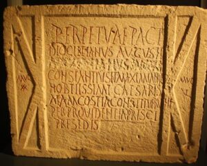 A block of Greek writing chiseled into stone. 